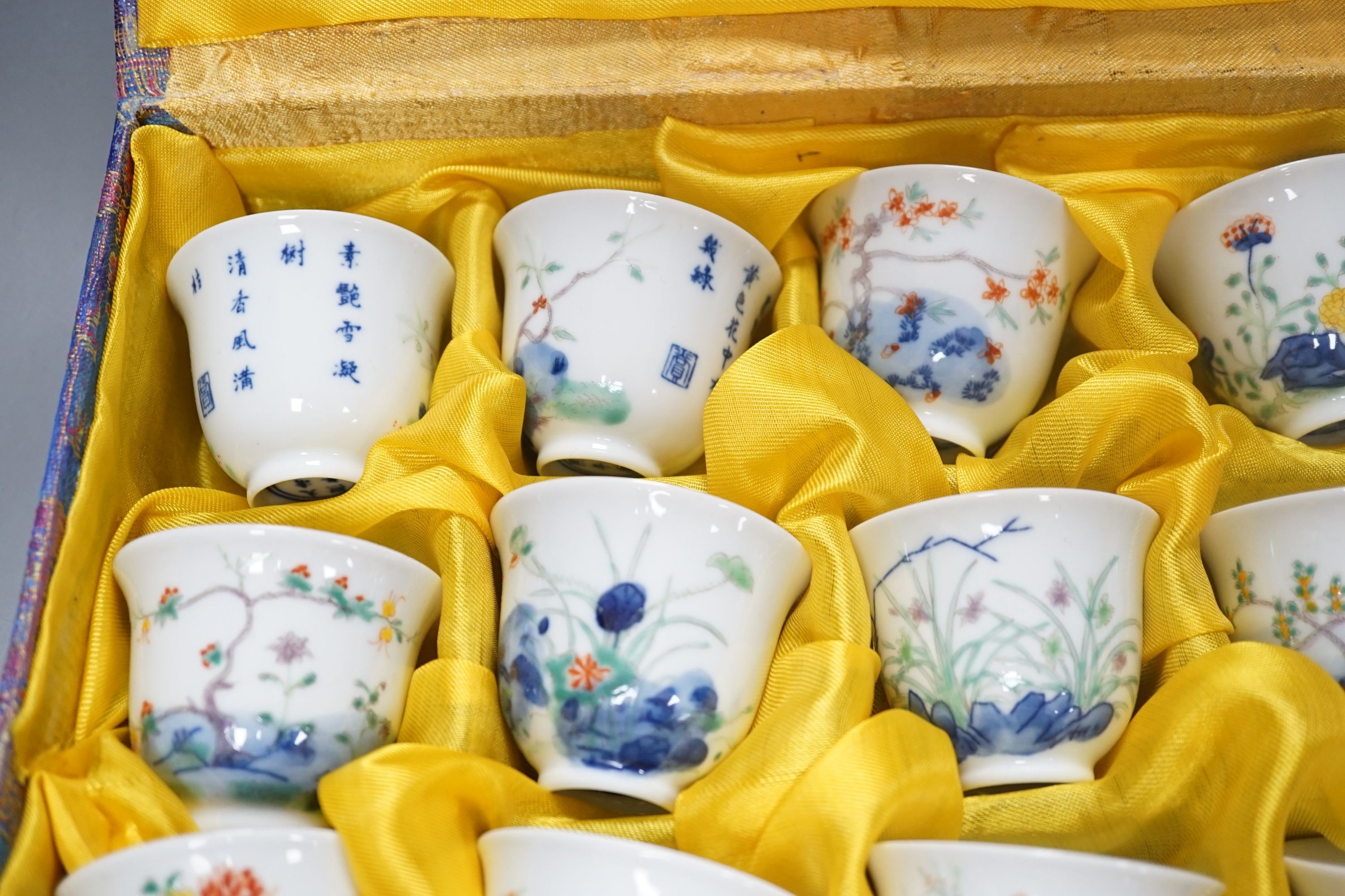 A Chinese boxed set of twelve wucai ‘month’ cups